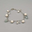 Braccialetto con perle bianche e mezzi cristalli 